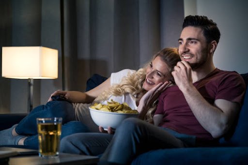Young couple relaxing by watching movie
